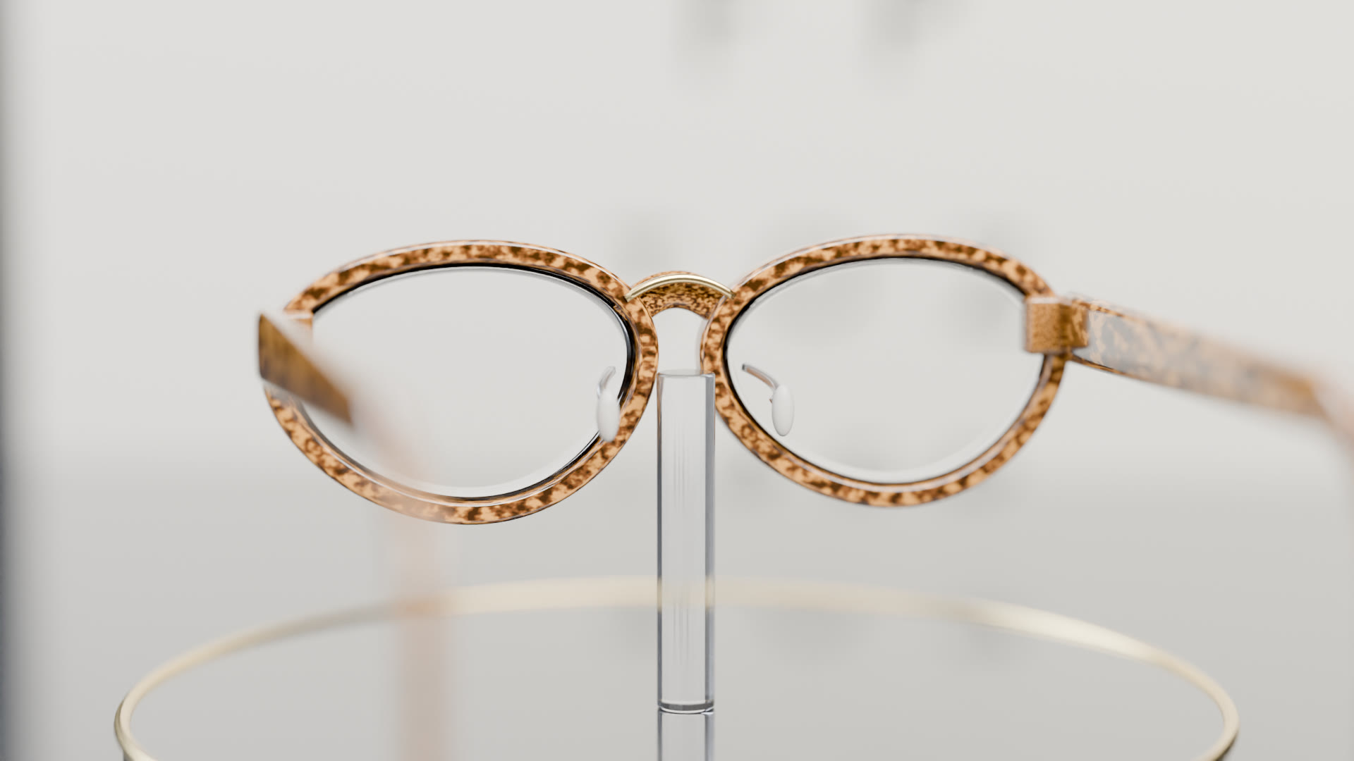 Cycles render of tortoiseshell spectacles on an acrylic stand, an eye chart behind, the letters bending through the lenses